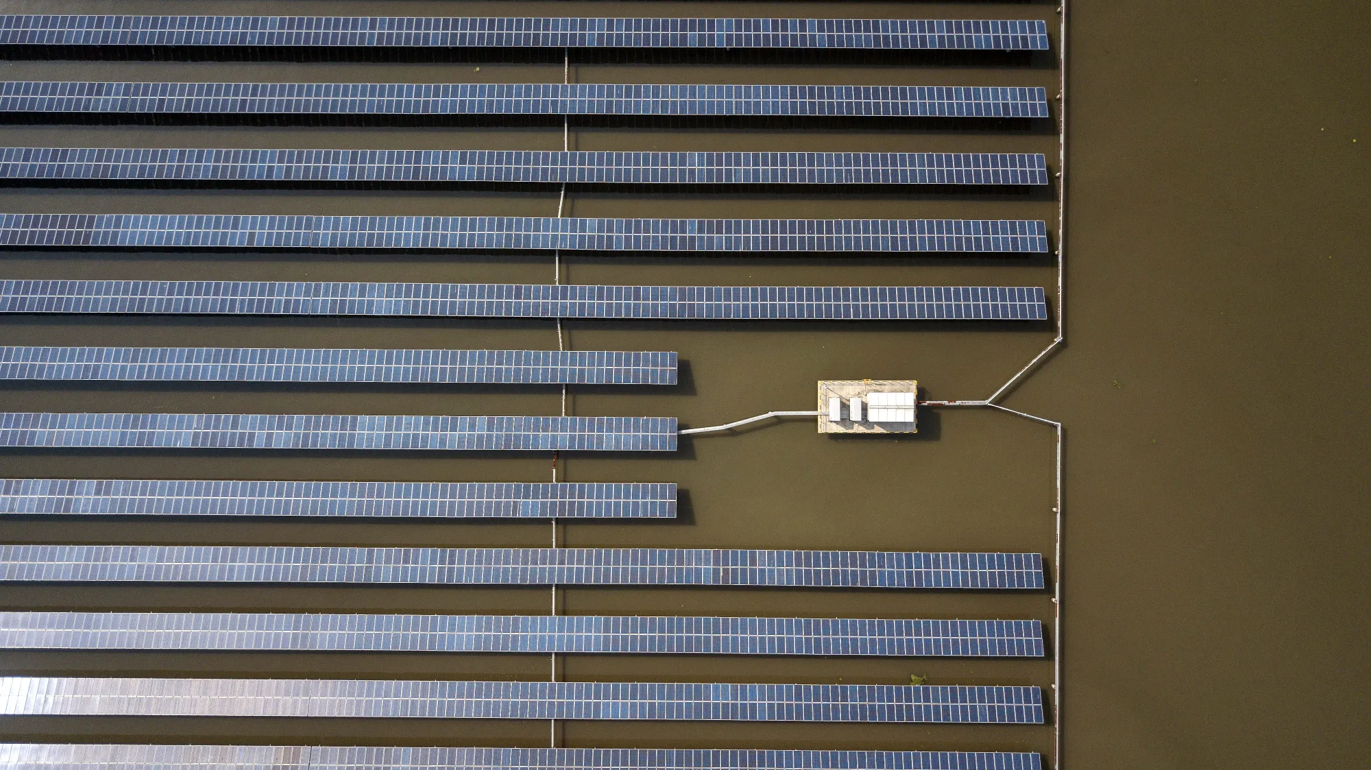 Photo voltaic panels stand at a solar farm
