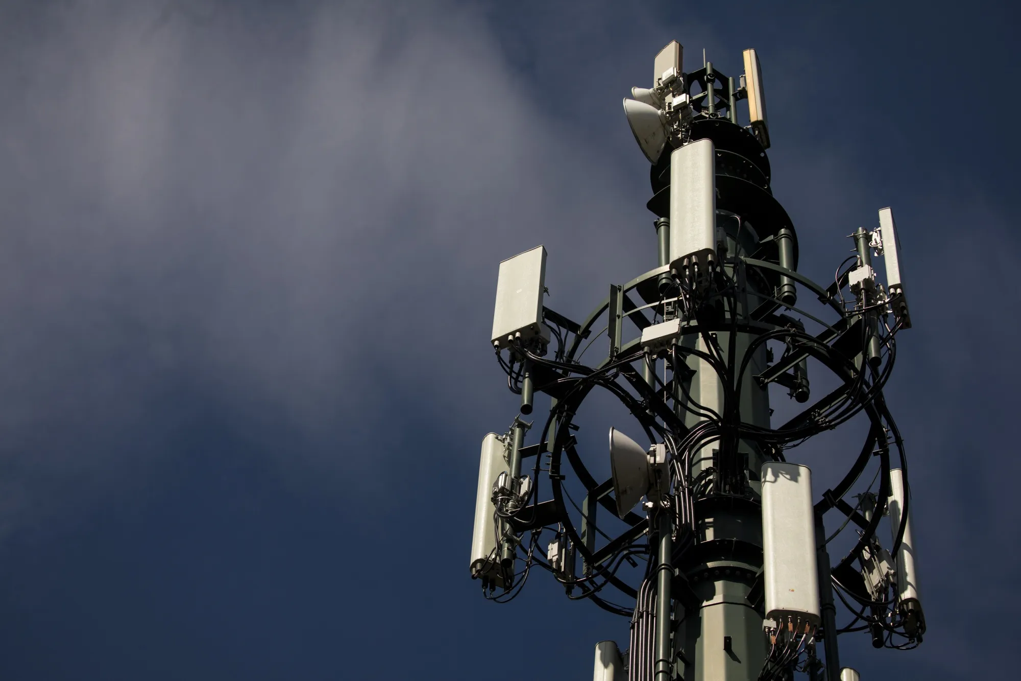Antennas sit on a mobile phone telecommunications mast in Reading.
