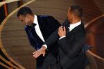 Will Smith, right, slaps Chris Rock onstage during the 94th Oscars at the Dolby Theatre in Hollywood, California on March 27.