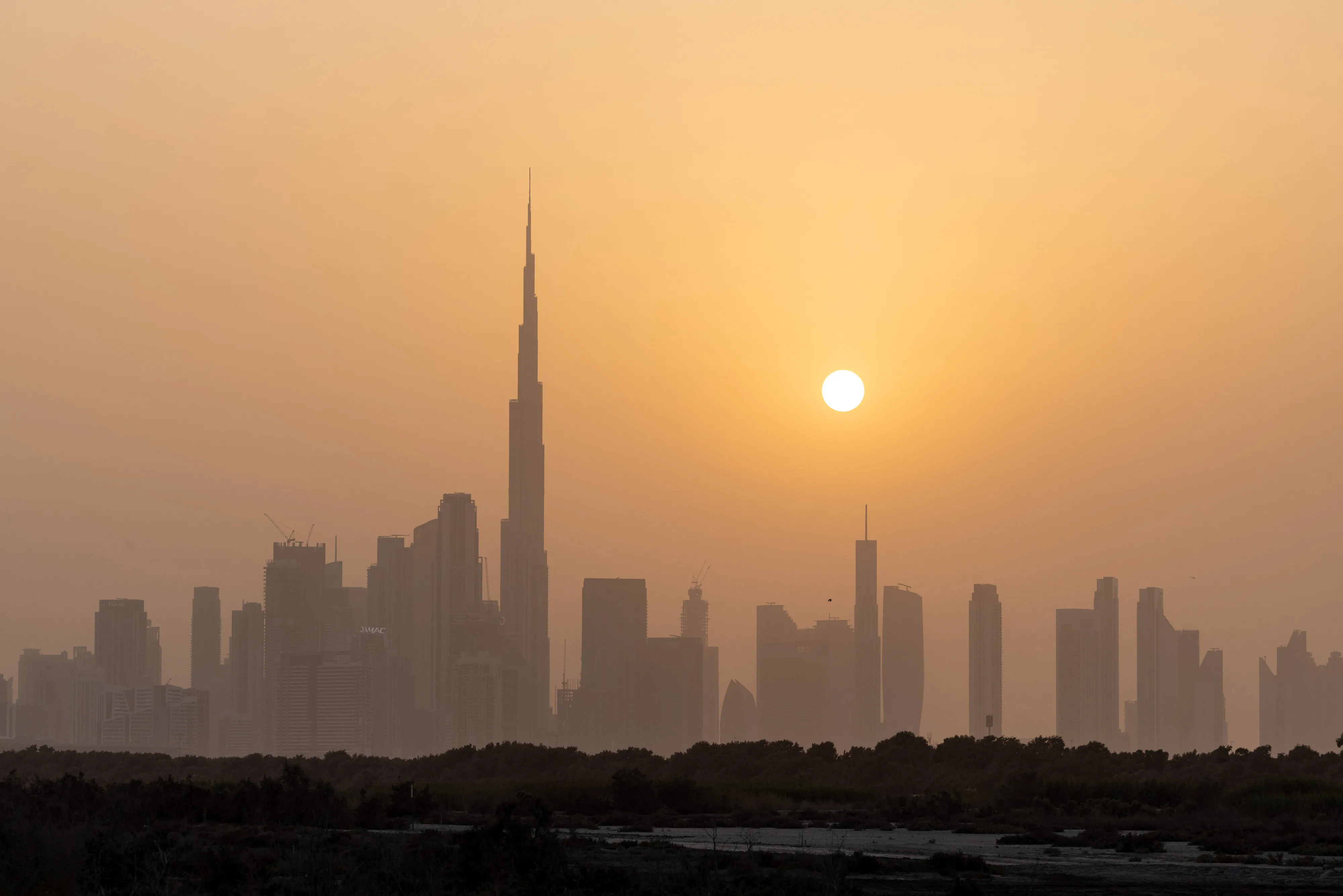 The Burj Khalifa skyscraper, center left, on the city skyline in Dubai, United Arab Emirates.