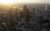 The early morning sun rises beyond skyscrapers including Tower 42, the Heron Tower, the Leadenhall building, also known as the "Cheesegrater," 30 St Mary Axe, also known as "the Gherkin," 20 Fenchurch Street, also known as the "Walkie-Talkie," and the Shard stand surrounded by commercial office buildings in this aerial photograph taken with a tilt-shift lens over the City of London, U.K., on Thursday, Dec. 19, 2013. The pound approached a two-year high versus the dollar after Bank of England policy maker Andrew Bailey said the central bank may take steps to prevent U.K. house prices from rising too quickly.