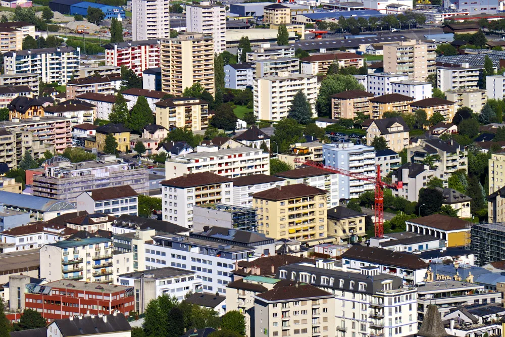 Residential apartment blocks stand in Martigny, Switzerland.