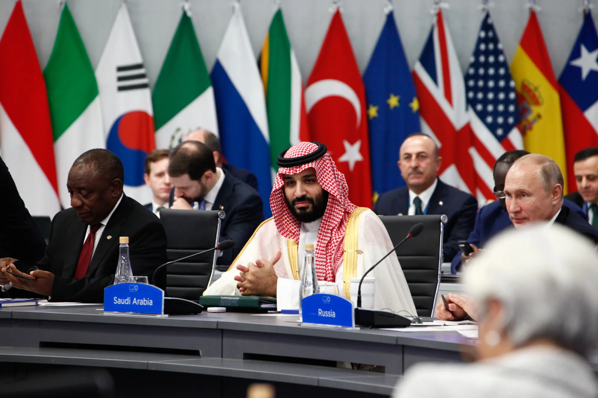 Mohammed Bin Salman and Vladimir Putin attend the plenary at the G-20.