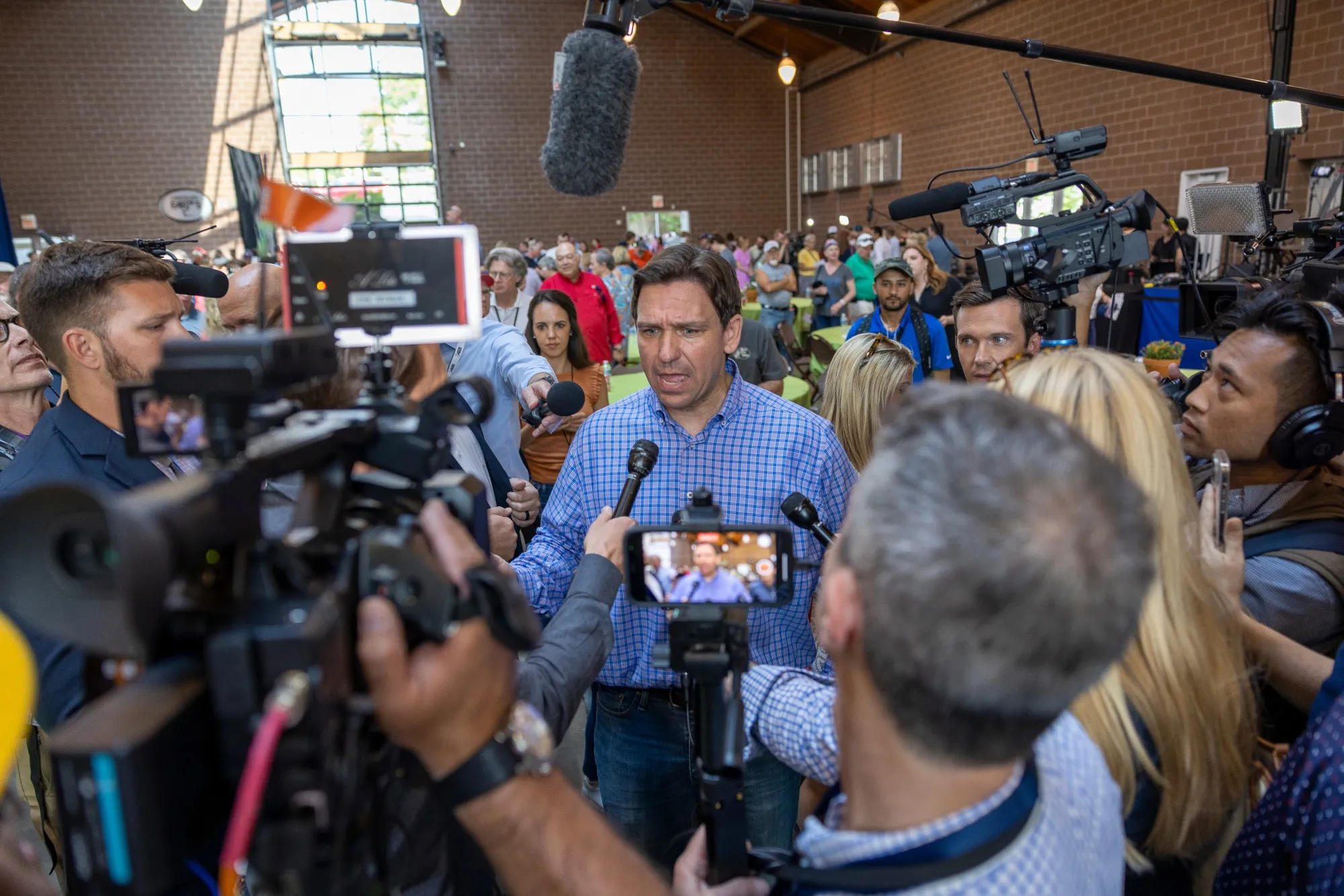 Ron DeSantis speaks to members of the media during the Roast and Ride in Des Moines, Iowa.