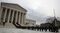 Law clerks past and present line the steps as the casket of Associate Justice Antonin Scalia is carried by U.S. Supreme Court police officers up the steps of the Supreme Court building on Feb. 19, 2016, in Washington.