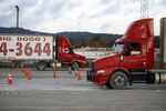 Students drive semi trucks while practicing for their commercial driver's license (CDL) test at Truck America Training of Kentucky in Shepherdsville, Kentucky.