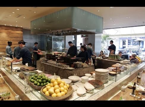 Chefs work in the kitchen of Roka