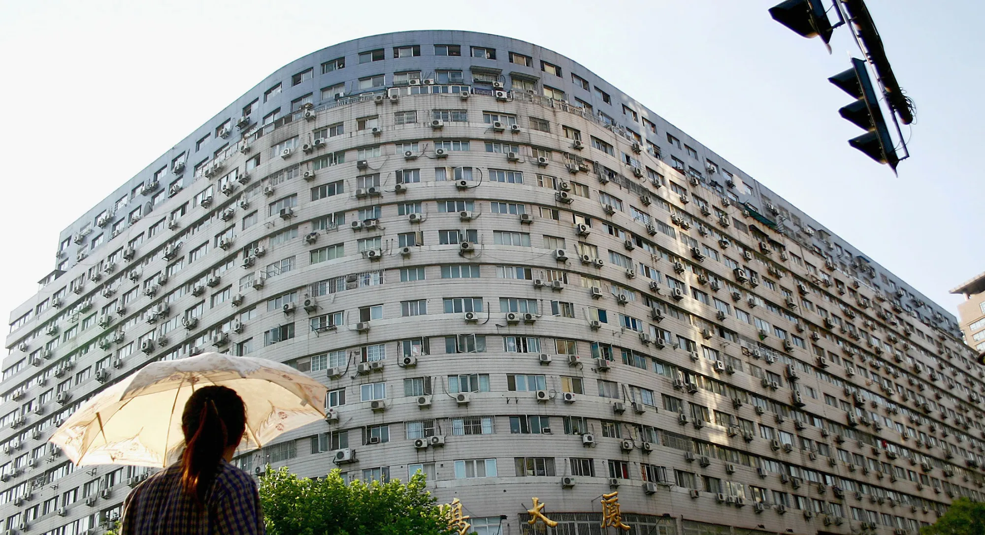 The exterior of a building shows a vast amount of of air conditioning units being used by residents in Nanjing, Jiangsu Province, China.
