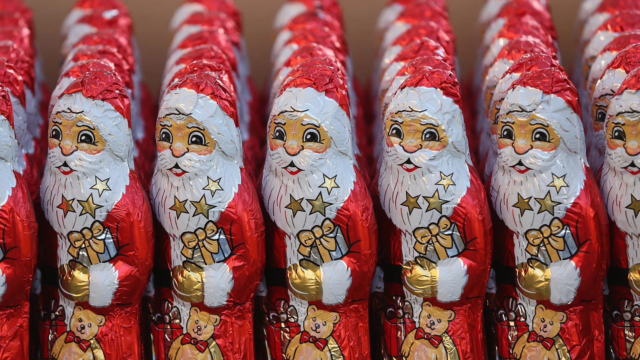 MICHENDORF, GERMANY - DECEMBER 06: Chocolate figurines in the form of St. Nicholas, or Santa Claus, stand in rows before they were given to participants in the 7th annual Michendorf Santa Run (7. Michendorfer Nikoauslauf) on December 6, 2015 in Michendorf, Germany. A record 900 runners took part in this year's event, which included 2,5km, 5km and 10km races.

