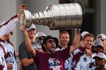 Colorado Avalanche center Nazem Kadri hoists the Stanley Cup at a rally for the NHL hockey champions Thursday, June 30, 2022, in Denver. (AP Photo/Jack Dempsey)