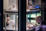 A shopkeeper assists a customer at a luxury watch store in Lugano, Switzerland, on Nov. 20.
