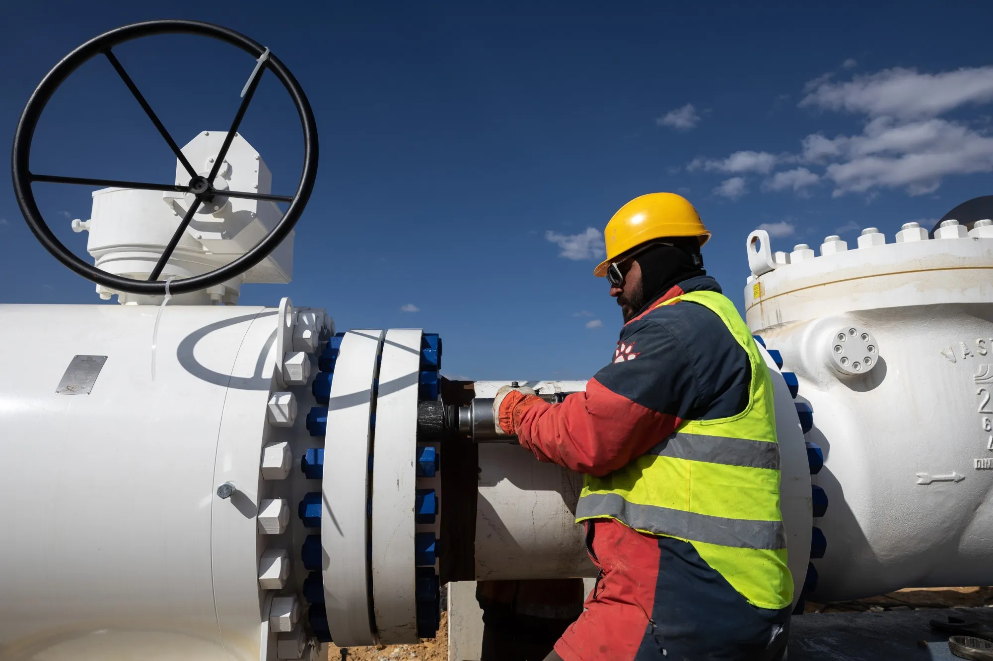 An employee works on pipework at the construction site of the Gas Interconnector Greece-Bulgaria (IGB) natural gas pipeline in Komotini, Greece.