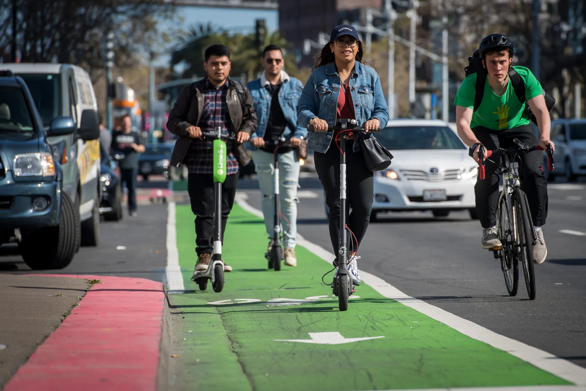 People ride shared electric scooters&nbsp;in San Francisco on&nbsp;April 13.