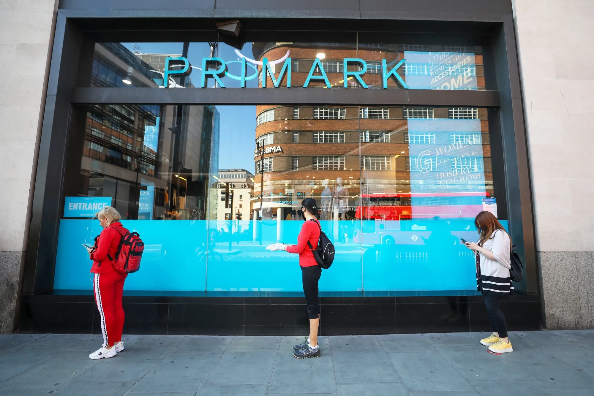 Customers line up to enter a Primark store in London, on June 15.