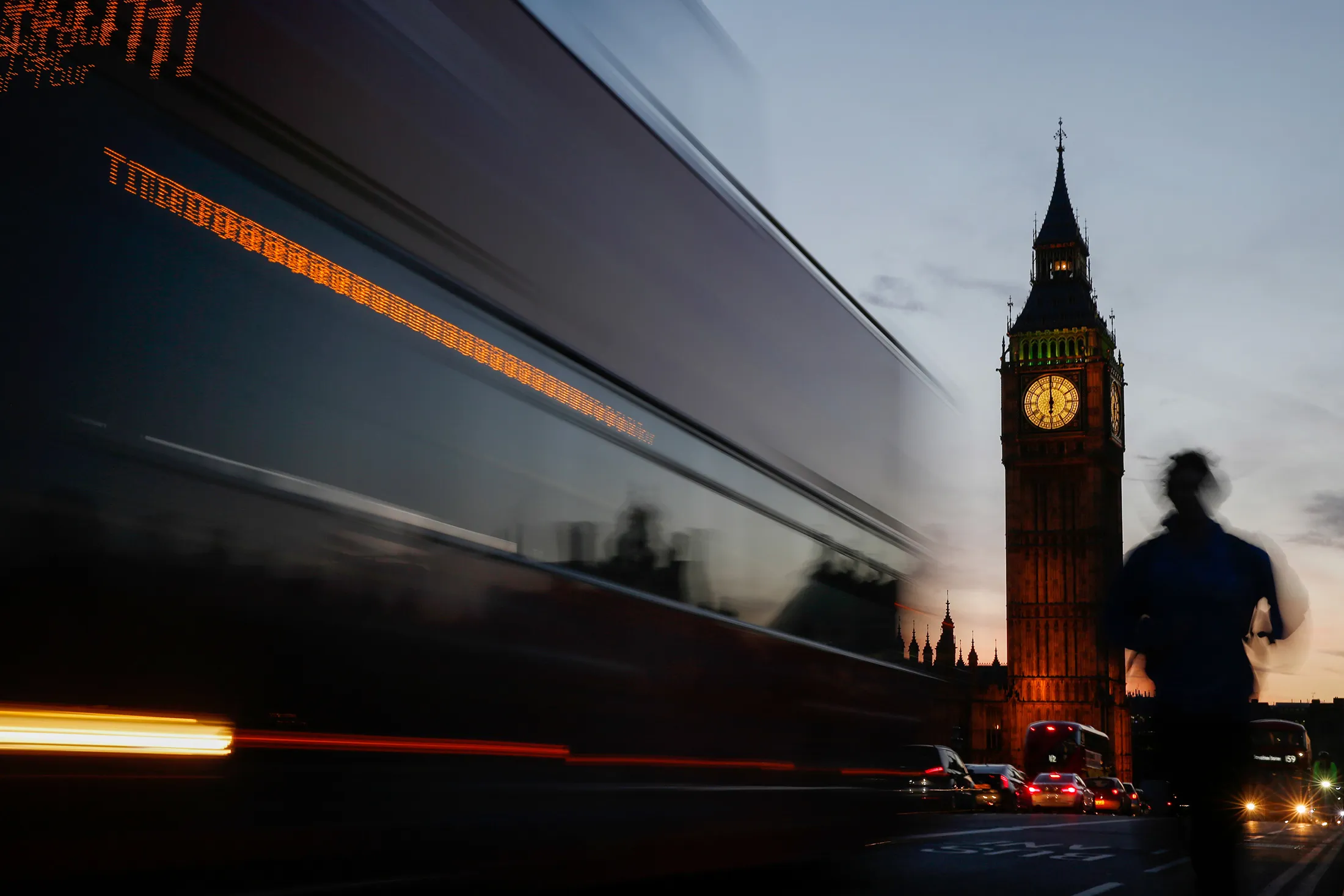 A bus passes the Houses of Parliament and Elizabeth Tower, also known as 'Big Ben', in London, U.K., on Thursday, March 2, 2017.
