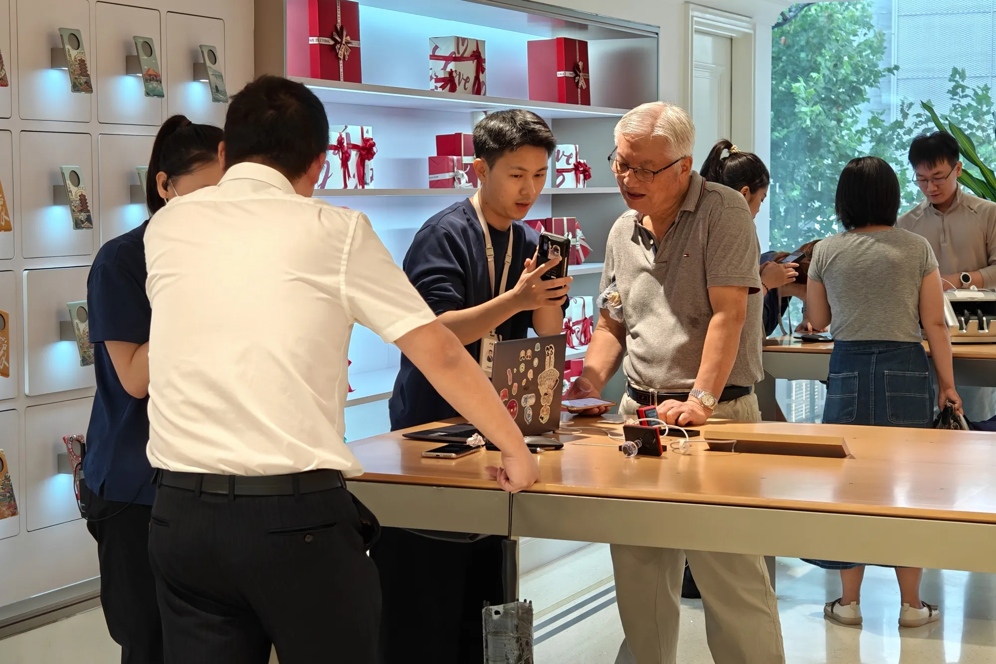 Customers line up to make an appointment to buy Huawei's Mate 60pro mobile phone at Huawei's flagship store in Shanghai.