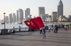 A man launches a kite in the shape of the Chinese national flag on the Bund in Shanghai, China, on Friday, Oct. 2, 2015. China's consumer inflation moderated and factory gate deflation extended a record stretch of declines, signaling the People's Bank of China still has room to ease monetary policy further to support a slowing economy.