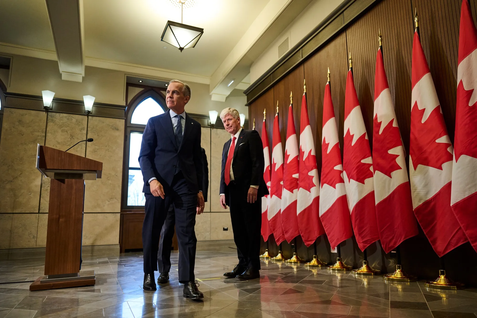 Prime Minister Mark Carney, left, and Energy Minister Tim Hodgson met decades ago when they both worked at Goldman Sachs.