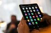 An attendee holds a Samsung Electronics Co. Galaxy Fold mobile device during an unveiling event in New York, U.S., on Monday, April 15, 2019. Samsung announced the phone in February and it goes on sale April 26 at the wallet-stretching price of $1,980.