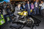 An attendee sits on a Harley-Davidson LiveWire electric motorcycle at CES.