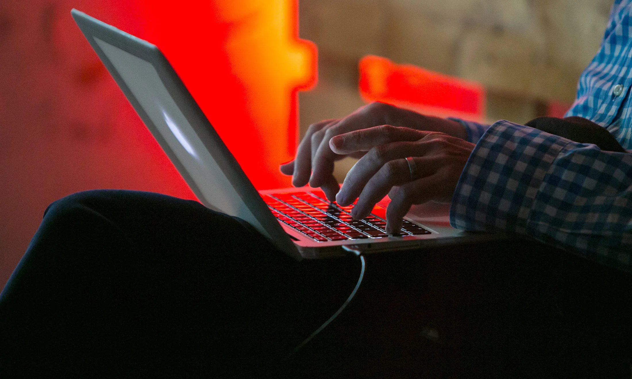 An attendee uses an Apple Inc. laptop during the Tech Open Air (TOA) technology conference in Berlin, Germany, on Wednesday, July 15, 2015.&nbsp;