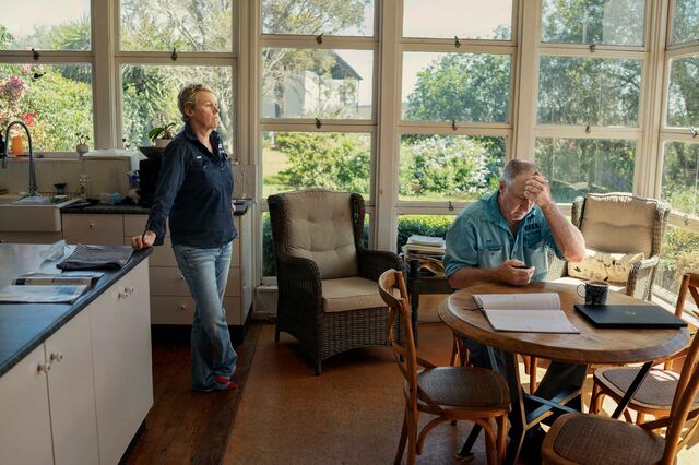 Dan and Karen Penfold, discuss business in their sunlight field kitchen and dining room.