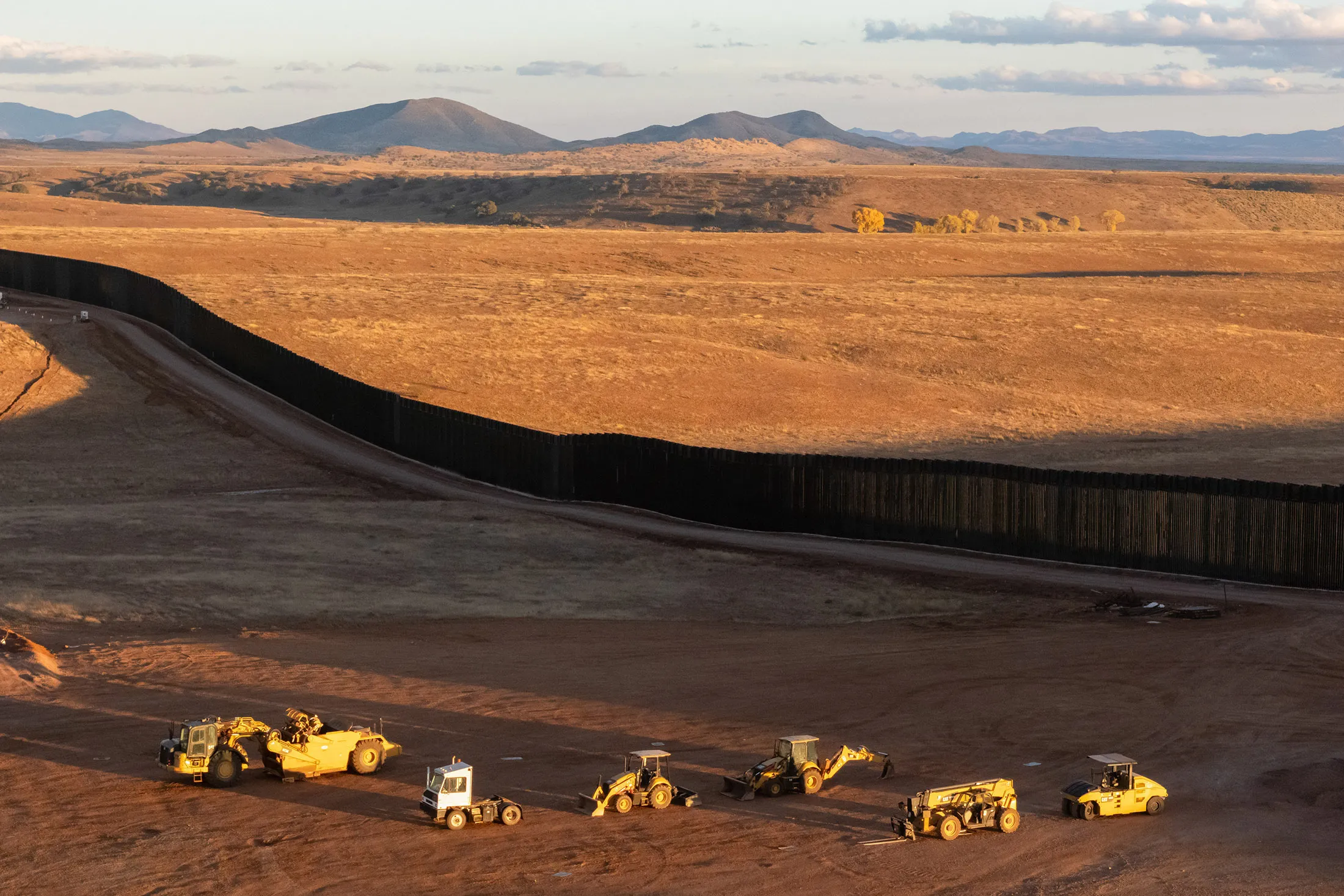Equipment near a newly constructed section of border wall at the US-Mexico border in San Rafael Valley, Arizona.