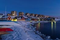 View over the old town and the colonial harbour towards the modern quarters of Nuuk. Nuuk. the capital of Greenland. America. North America. Greenland