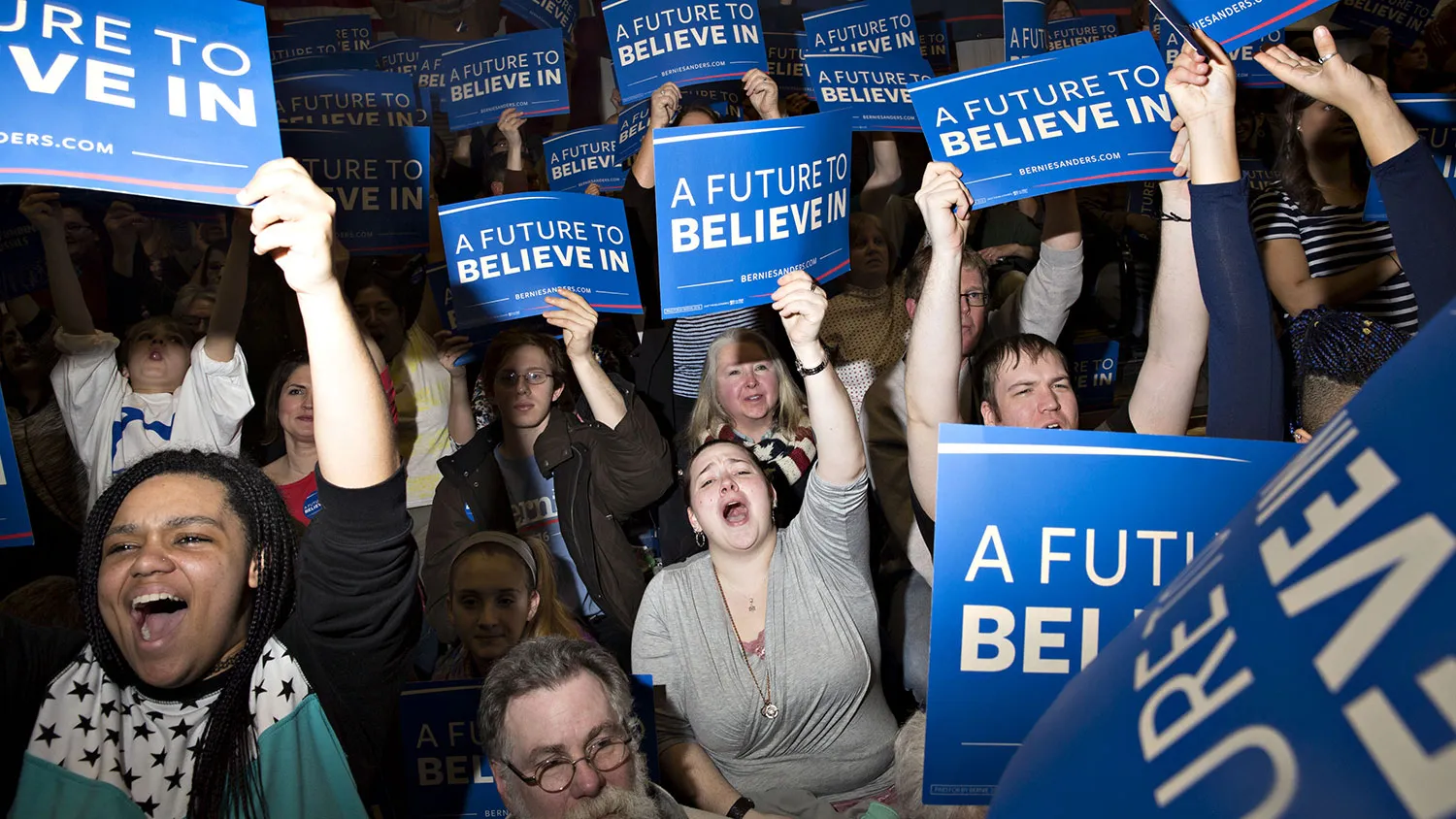 Attendees cheer as Senator Bernie Sanders speaks during a campaign event in Portsmouth, New Hampshire, on Feb. 7, 2016.
