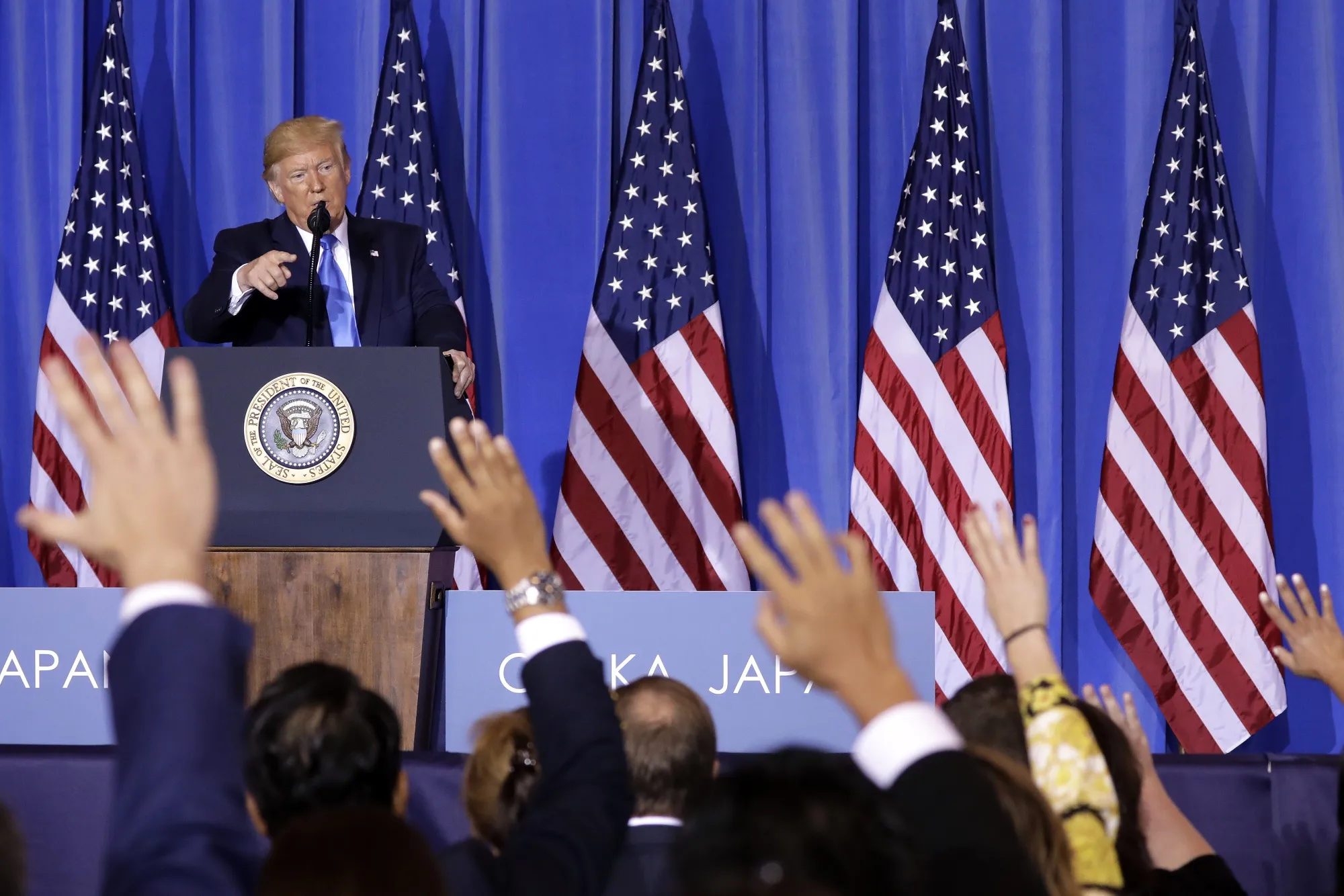 U.S. President Donald Trump takes questions during a news conference on June 29.
