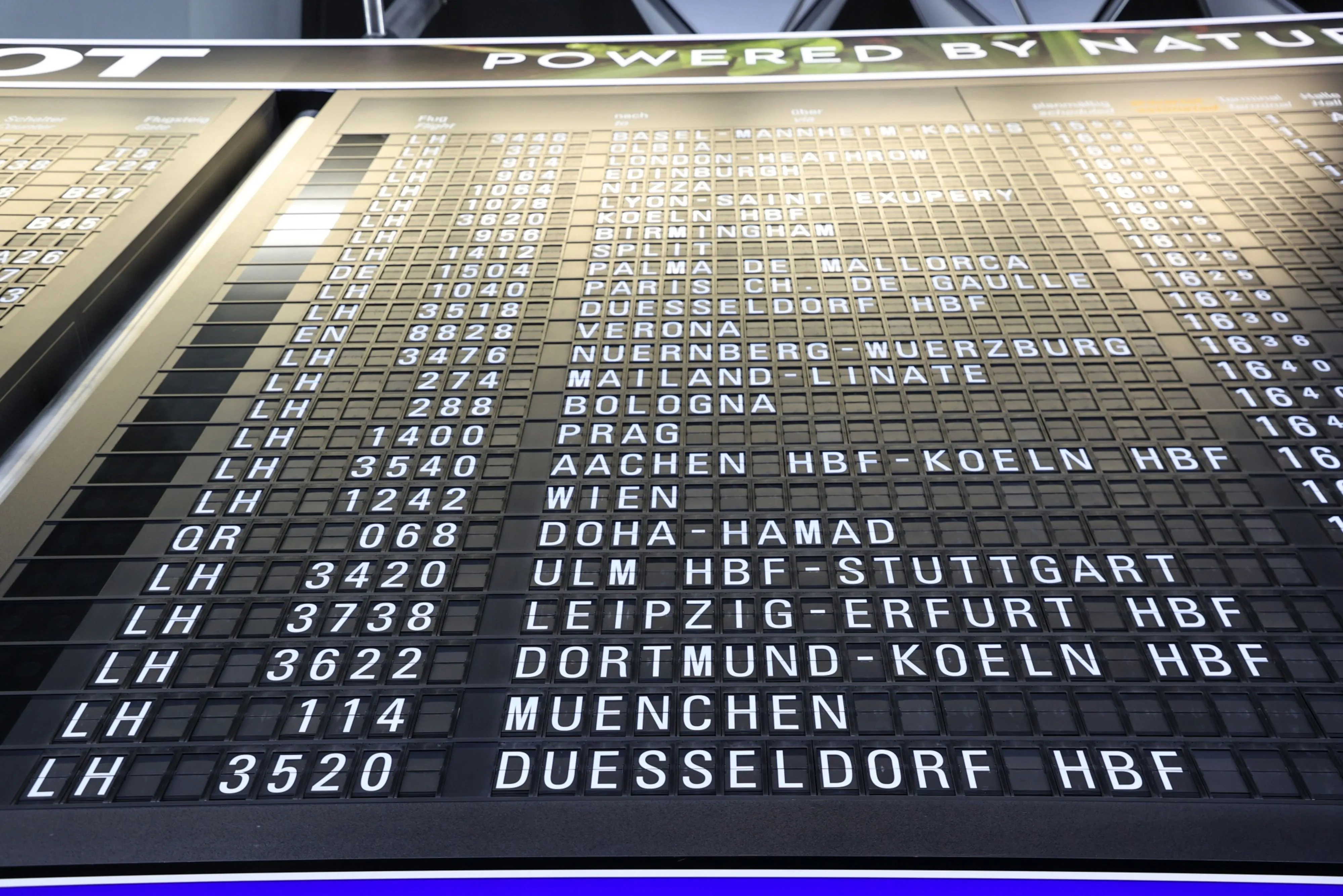 Trains and flights on a departure information board at Frankfurt Airport in April. Deutsche Lufthansa AG and German state railway Deutsche Bahn AG are cooperating&nbsp;on express-train services that could replace short-haul flights amid heightening concern about aviation’s carbon footprint.