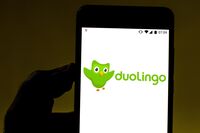 In this photo illustration the Duolingo logo is displayed on