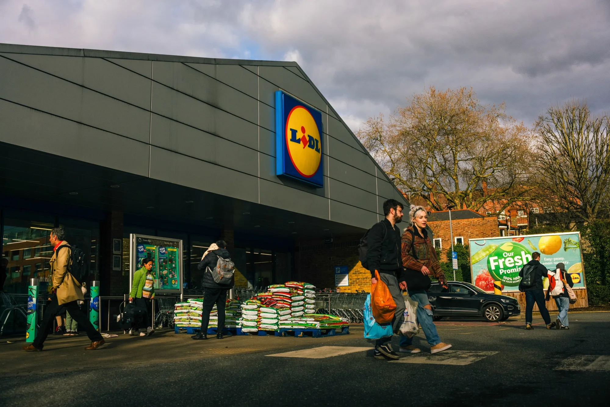 Shoppers leave a Lidl Ltd. supermarket in London, UK.