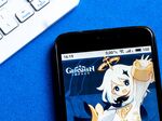 Genshin Impact is set in a fantasy world with dragons and magic, where players unlock anime-style characters and weapons via loot boxes they pay real money for.