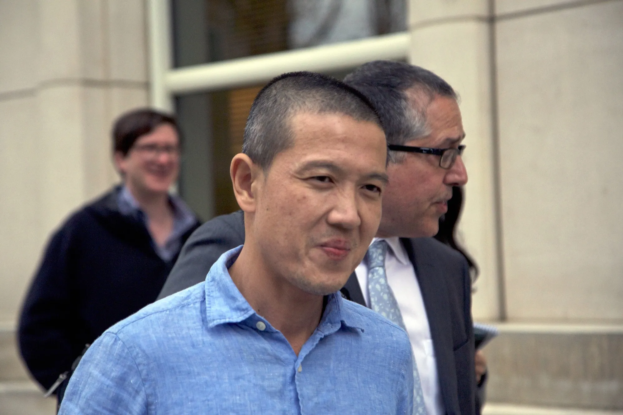 Roger Ng exits from federal court in the Brooklyn borough of New York on May 6, 2019.