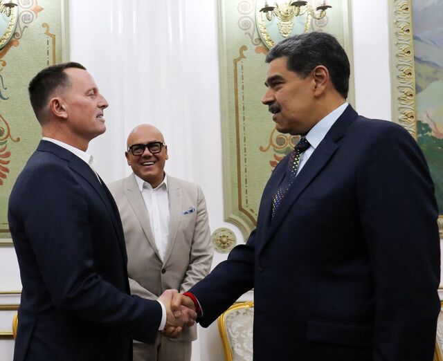 Maduro and Trump's envoy Richard Grenell shake hands at the Miraflores Palace in Caracas on Jan. 31.