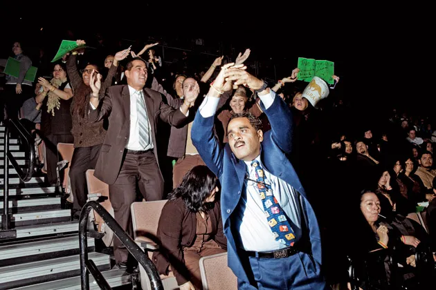 Pritesh Patel, a cage cashier at the MGM Grand, cheers on his co-workers