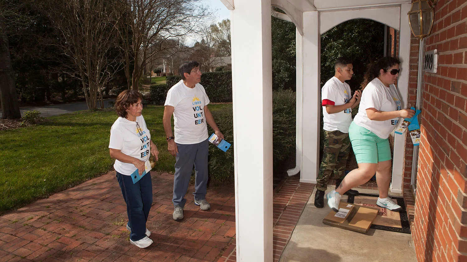 From left to right, Libre Initiative volunteers Virginia Faura, George Faura, David Silva, and Carmin Chavez canvass neighborhoods in Charlotte, North Carolina, on March 12, 2016.
