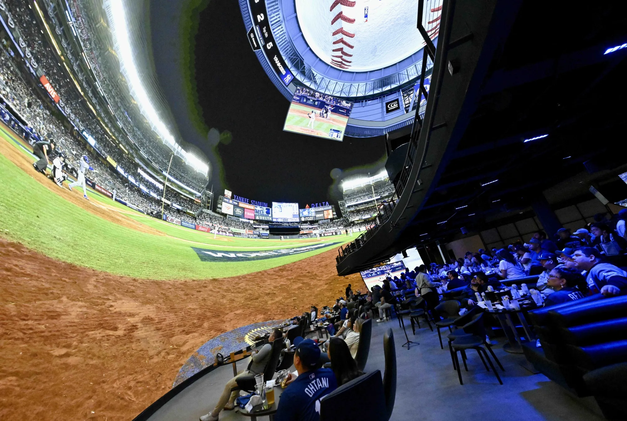 Field of dreams: Dodgers fans watch Game 4 of the 2024 World Series at Cosm Los Angeles in October 2024.