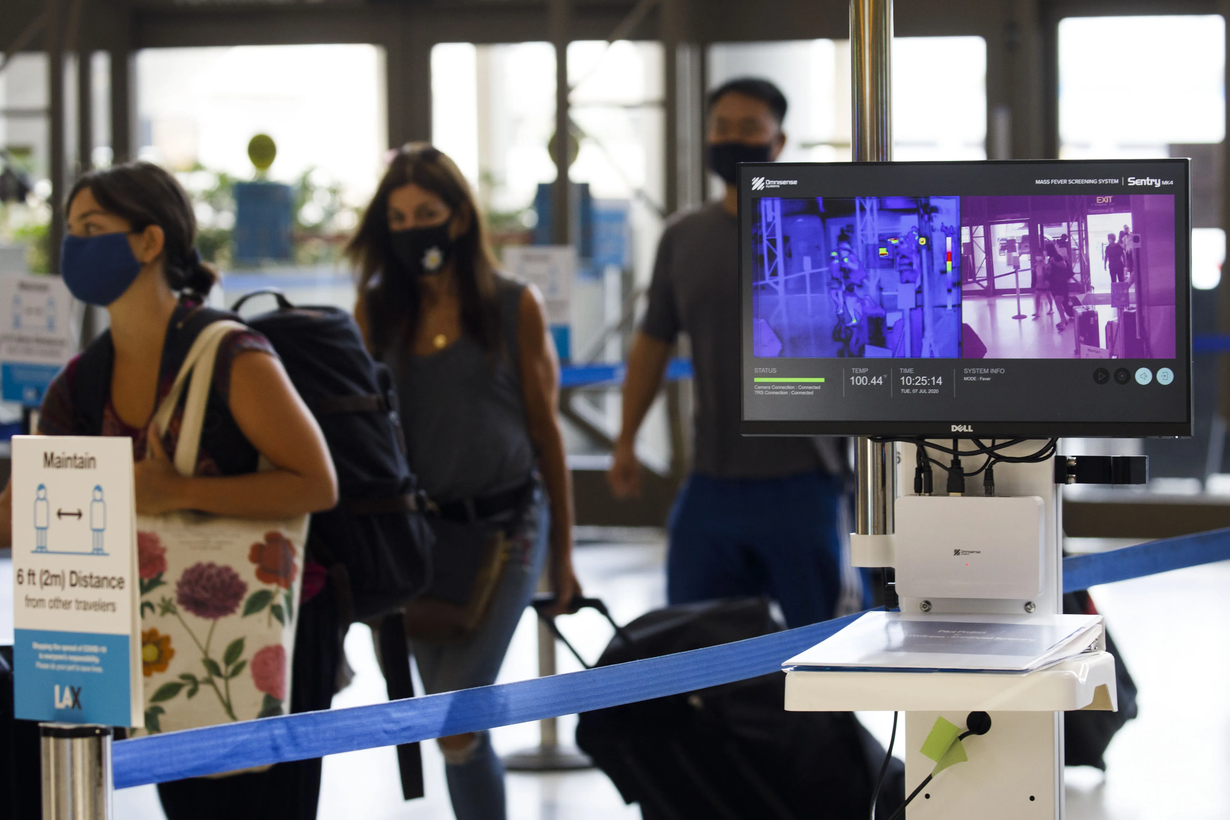 Passengers walk past thermal imaging cameras at Los Angeles International Airport&nbsp;in California&nbsp;on&nbsp;July 7.&nbsp;