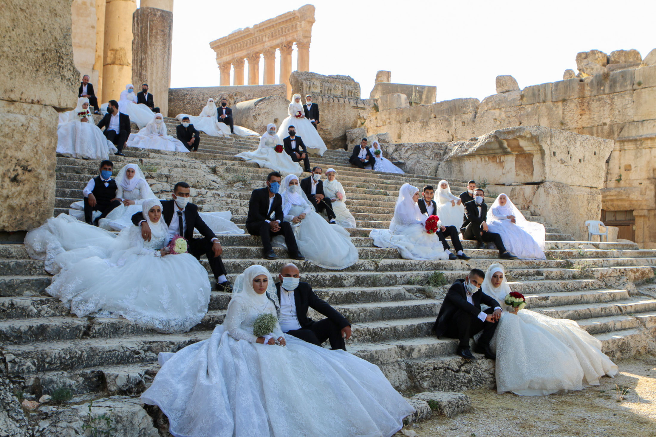 Weddings this fall are likely to feature masks and outdoor events.
(Photo by AFP via Getty Images)