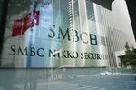 The logo of SMBC Nikko Securities Inc., a unit of Sumitomo Mitsui Financial Group Inc., outside its head office in Tokyo, Japan, on Thursday, Oct. 14, 2021.