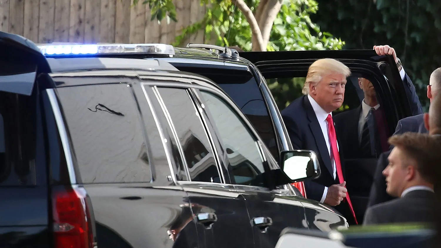Presumptive Republican presidential nominee Donald Trump arrives at RNC headquarters for a meeting with House Republicans on July 7, 2016, in Washington.
