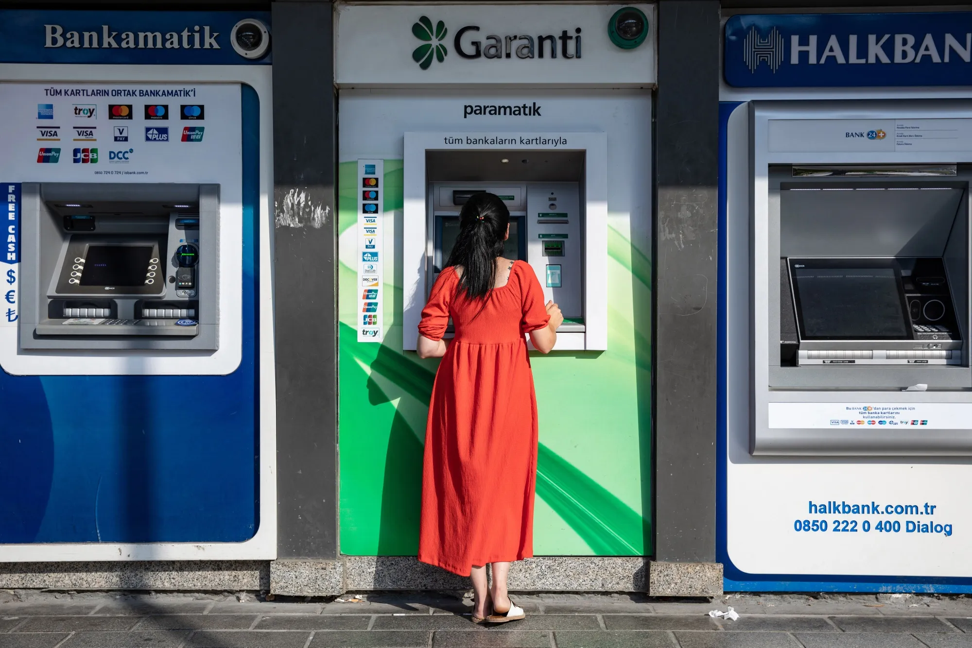A customer uses an&nbsp;ATM&nbsp;in Istanbul, Turkey.