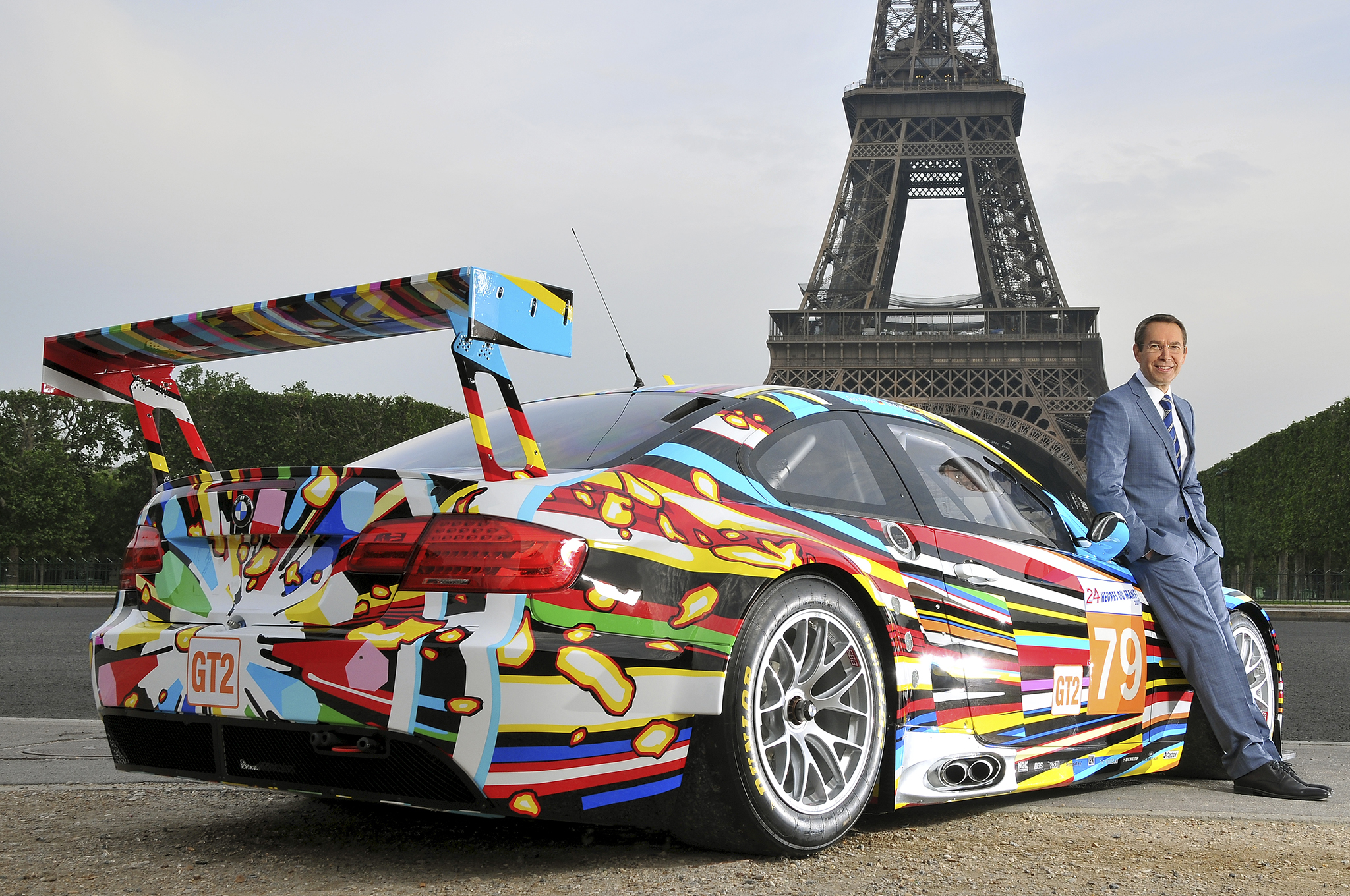 Artist Jeff Koons, seen here posing with his BMW M3 (2010), the latest addition to the BMW Art Car Collection. Source: BMW