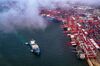 This photo taken on May 17, 2019 shows a container ship berthing at the port in Qingdao, in China's eastern Shandong province. - EU firms are "caught in the crossfire" of the US-China trade war, which is hurting the economic environment and exports to the United States, the European Union Chamber of Commerce in China said on May 20, 2019. (Photo by STR / AFP) / China OUT (Photo credit should read STR/AFP/Getty Images)