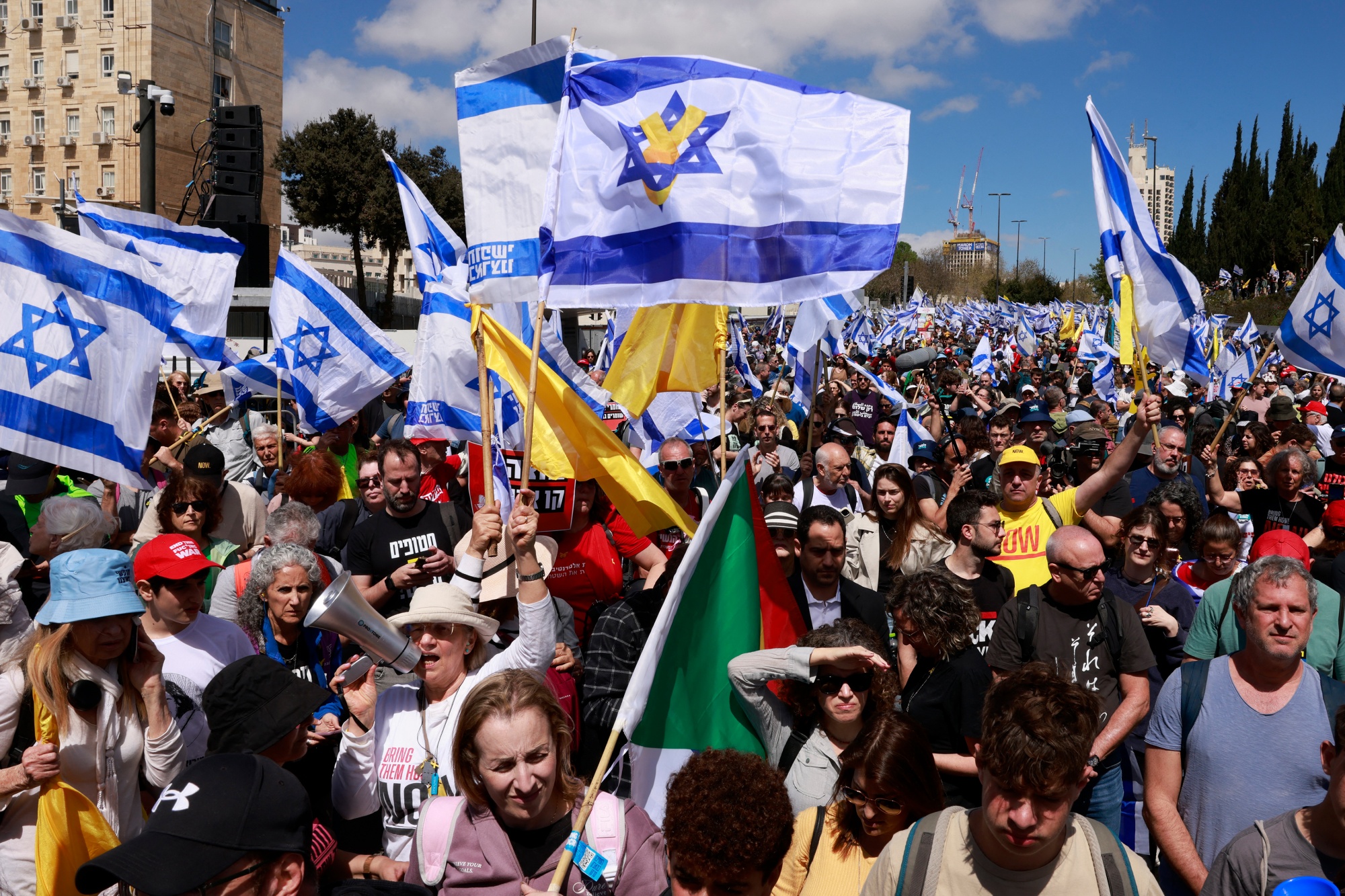 Protesters take part in a demonstration against Benjamin Netanyahu in Jerusalem on March 19. Photographer: Menahem Kahana/AFP/Getty Images