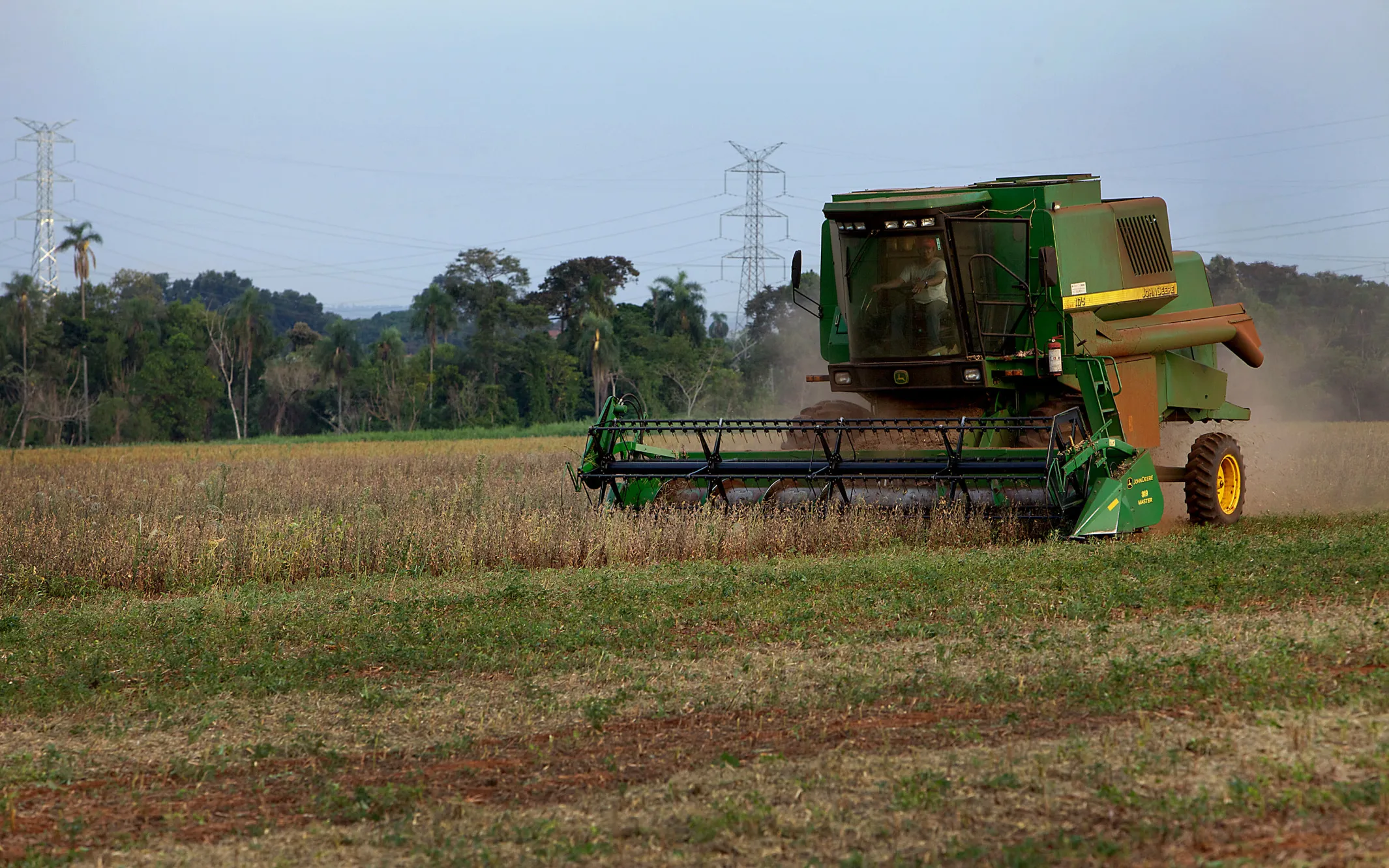A John Deere Co. 1175 hydro combine harvests soybeans on a farm in Santa Rita, Paraguay, on Friday, March 9, 2012.