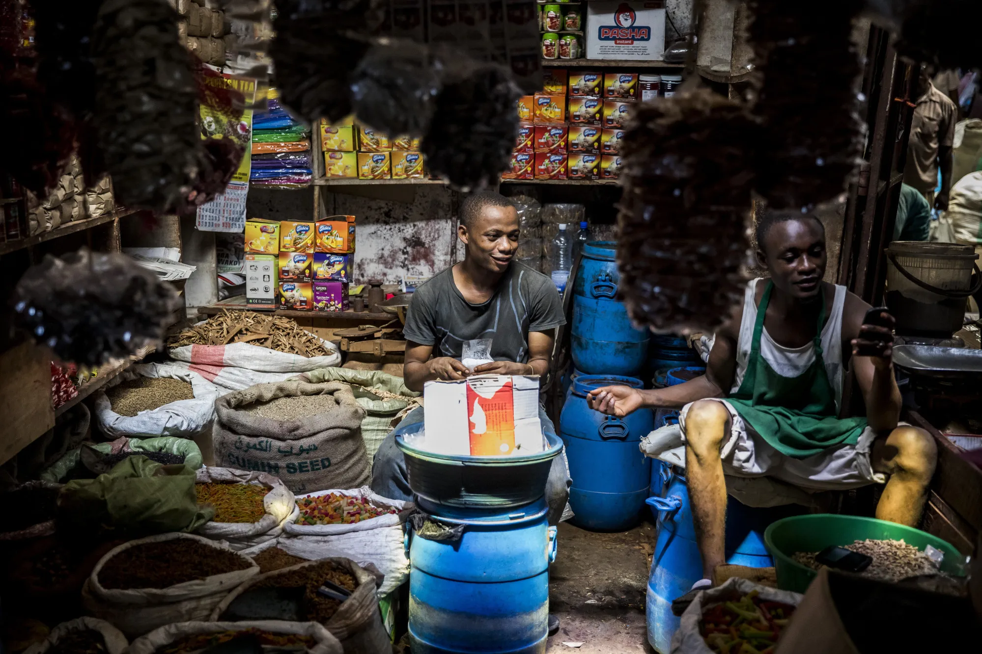 Two market traders selling fresh herbs and spices at a market&nbsp;in Mombasa, Kenya.