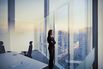 Businesswoman looking out window in meeting room
